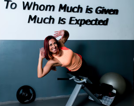 Motivated person pushing through a gym workout with determination